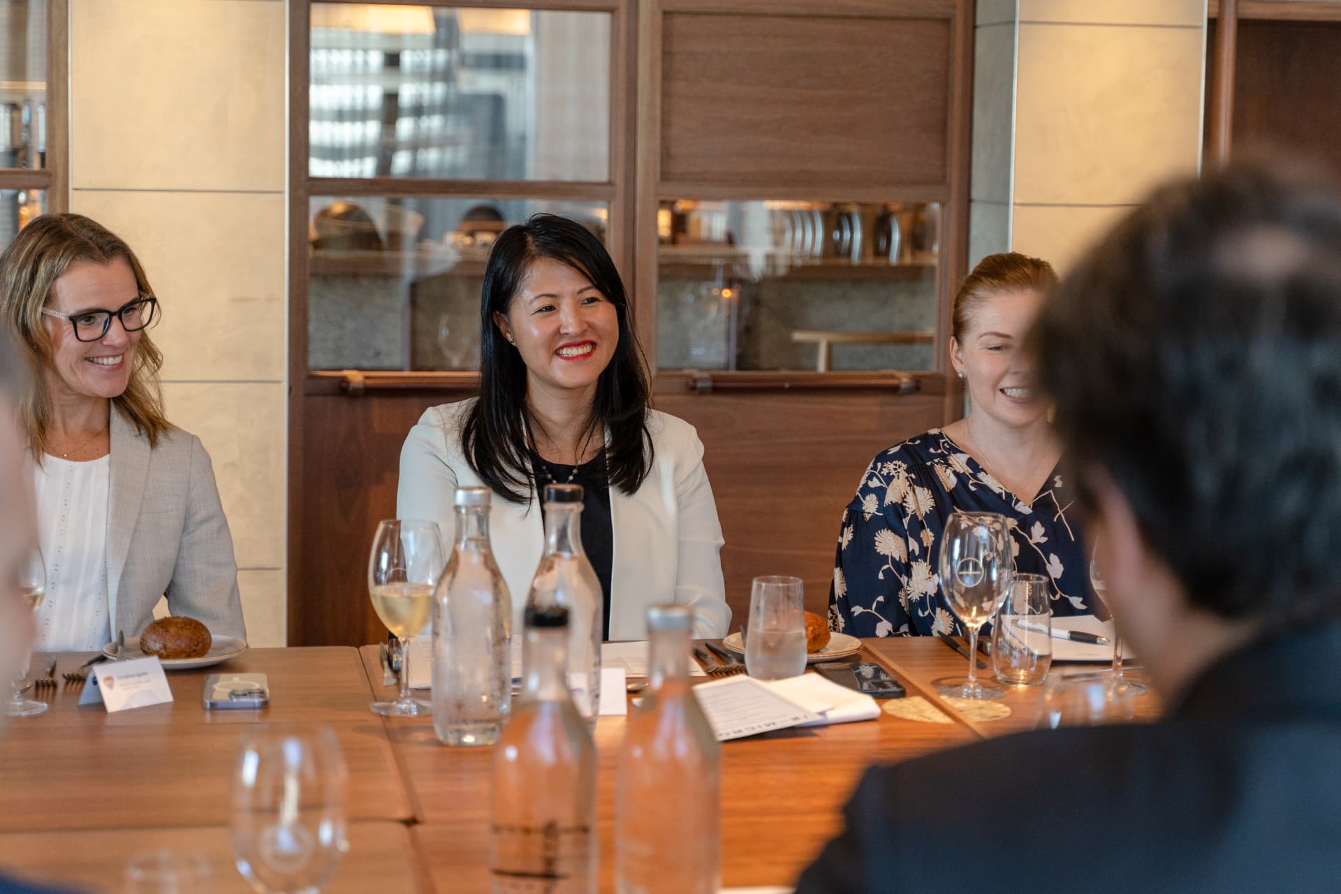 Lucy Lin in a roundtable discussion with executives